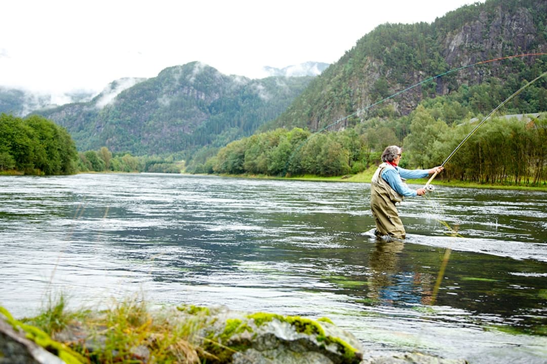 Fly fishing for salmon on the famous Suldalslågen river in Suldal, Norway