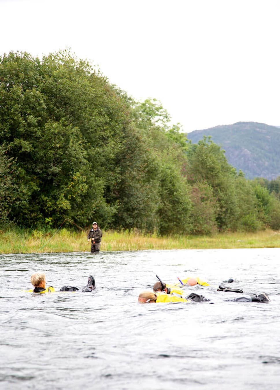 Adventurous river expedition on Suldalslågen with participants navigating the current
