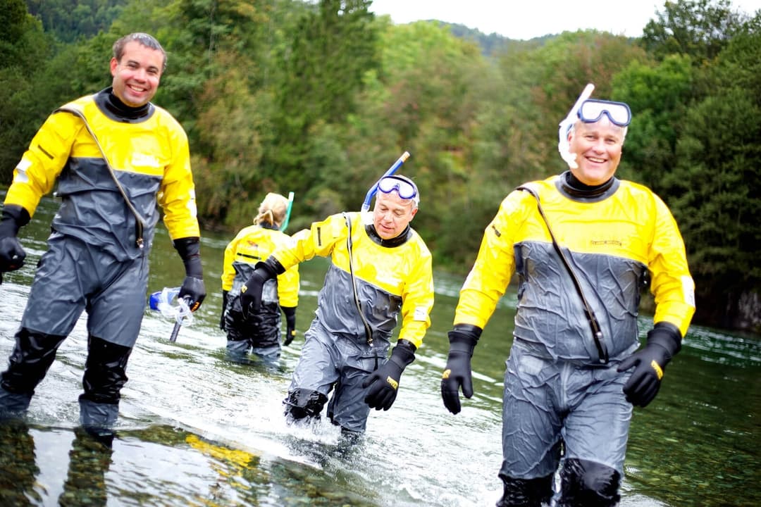 Guests floating on a guided salmon safari on the clear Suldalslågen river
