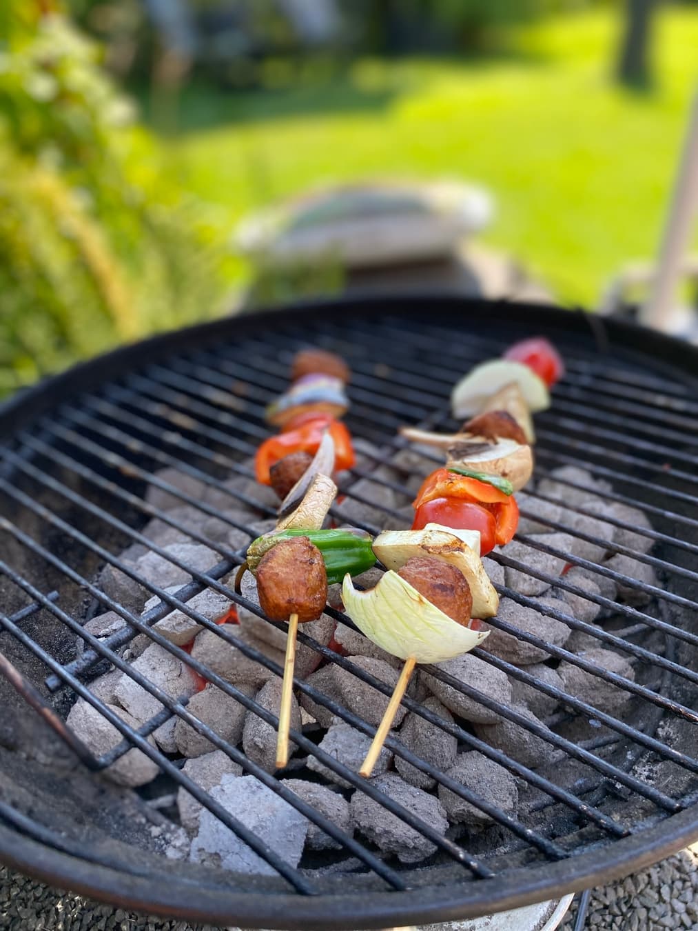 Outdoor BBQ dinner setup in a Swedish garden